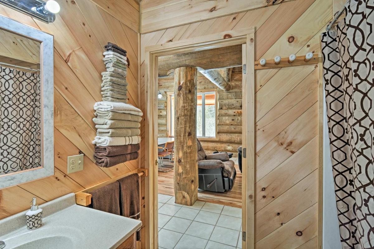 Custom Log Cabin with Deck and 45 Acres by Pine River! - Housity
