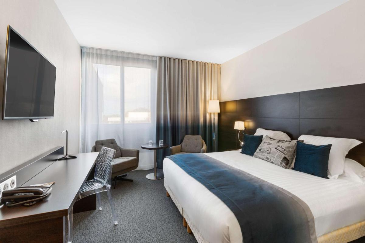 Un ou plusieurs lits dans un hébergement de l'établissement Best Western Plus Europe Hôtel Brest