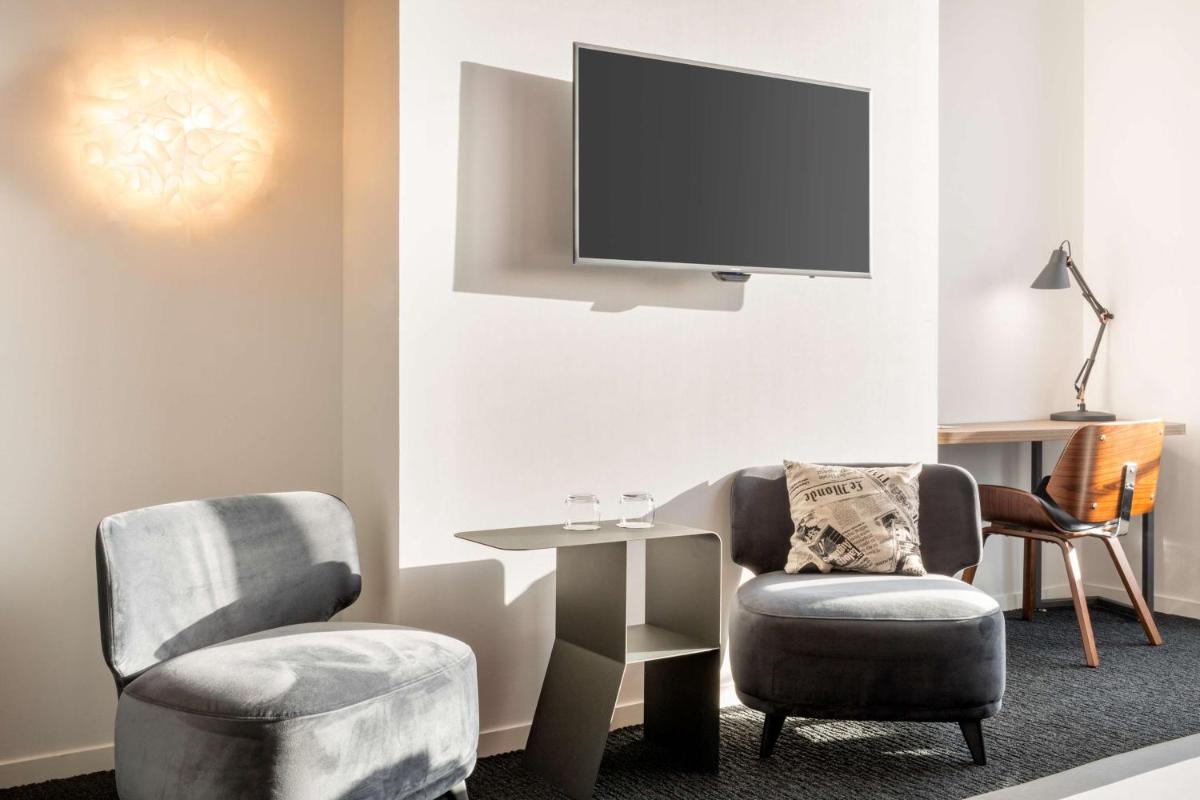 Télévision ou salle de divertissement dans l'établissement Best Western Plus Europe Hôtel Brest