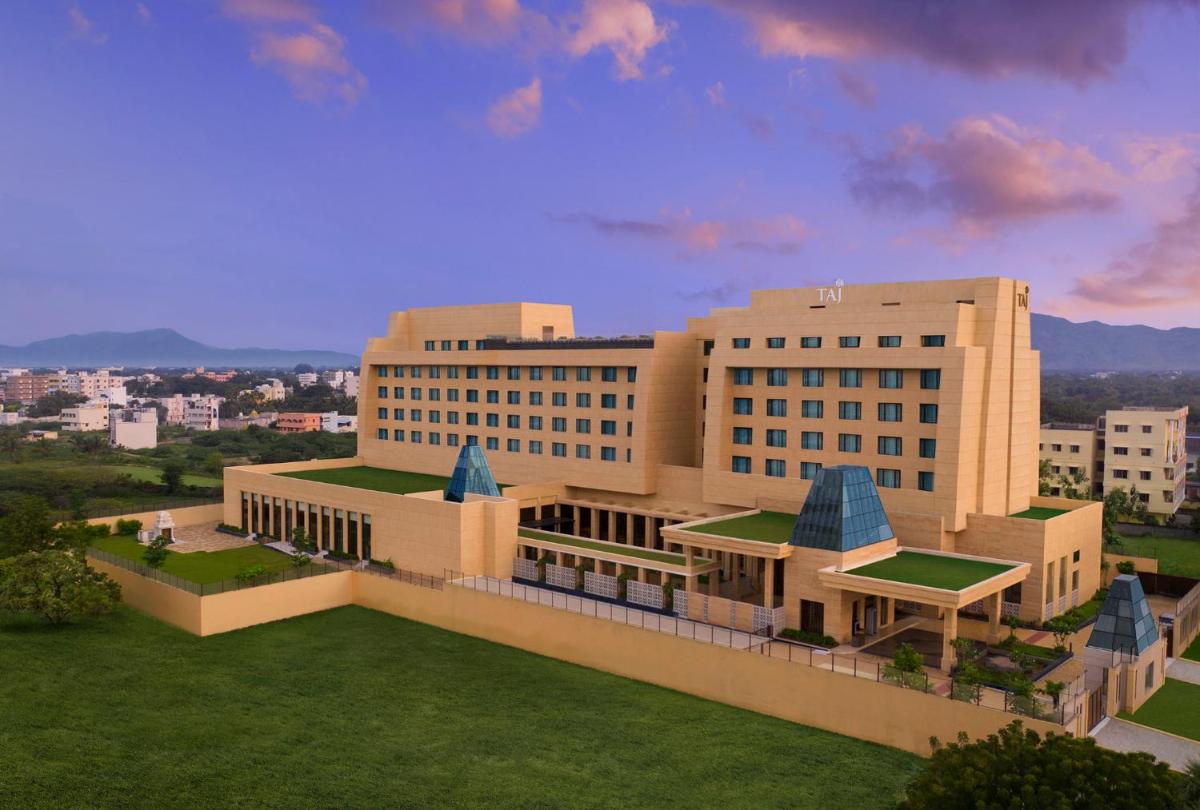 a rendering of a large building with a lawn at Taj Tirupati in Tirupati