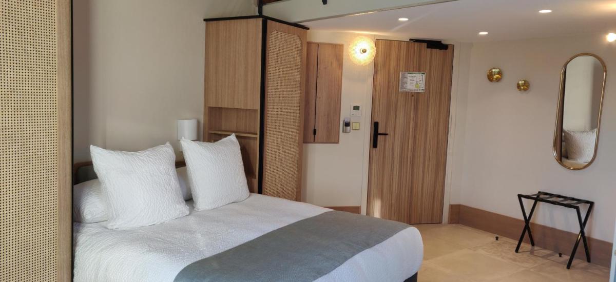 Un ou plusieurs lits dans un hébergement de l'établissement Splendid Hôtel & Spa
