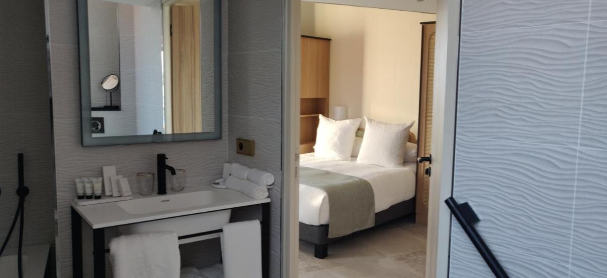 Un ou plusieurs lits dans un hébergement de l'établissement Splendid Hôtel & Spa