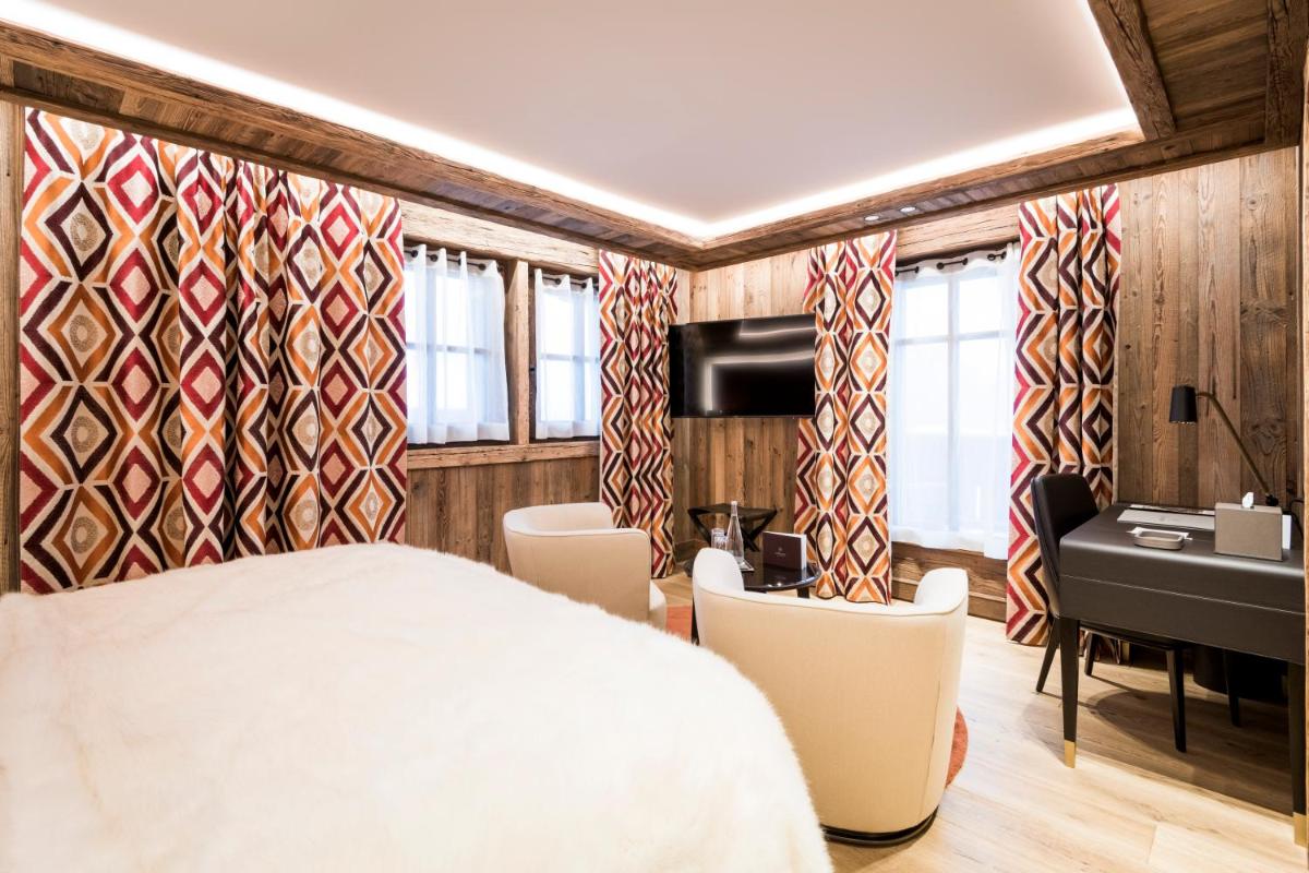 Un ou plusieurs lits dans un hébergement de l'établissement Armancette - The Leading Hotels of the World