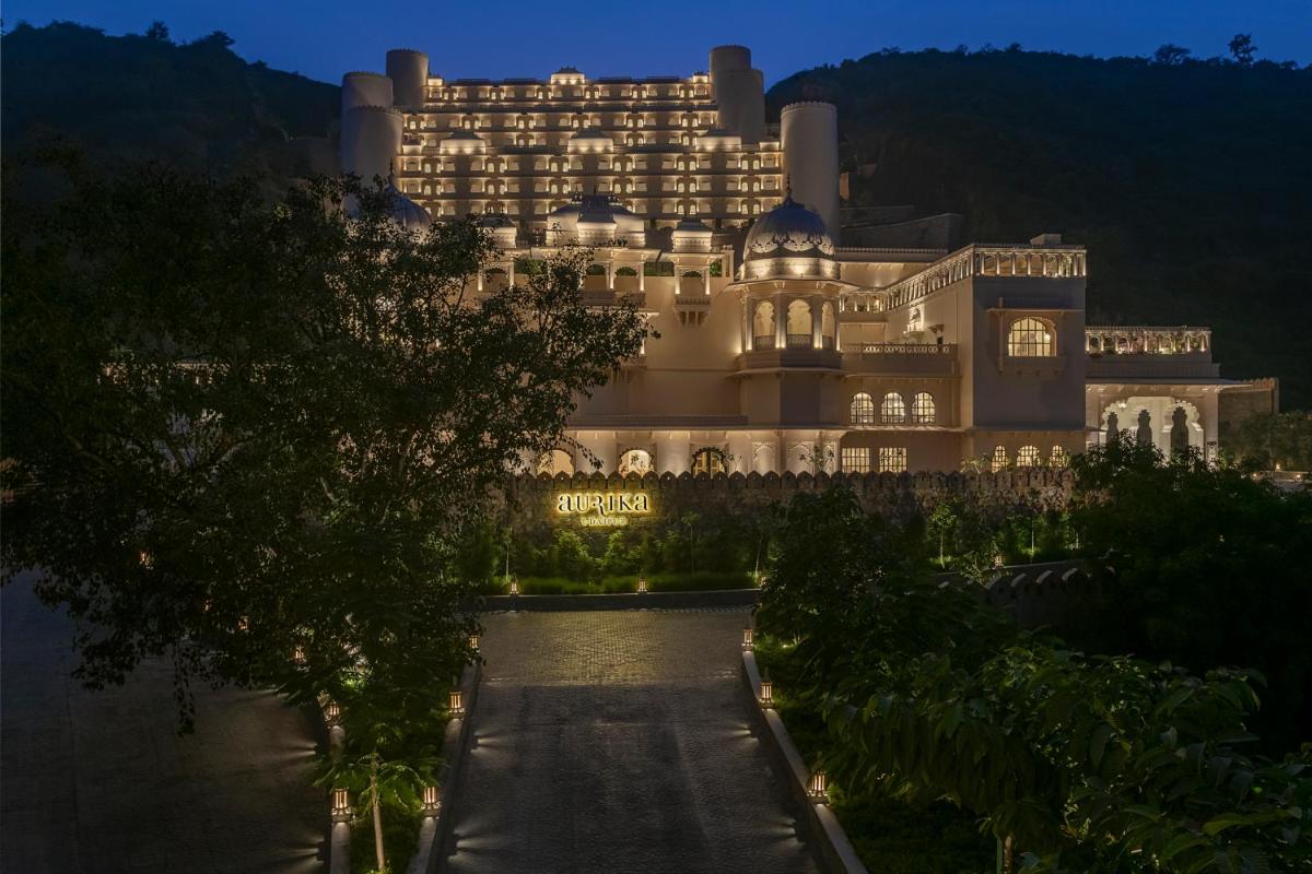 a large building with a pathway in front of it at Aurika, Udaipur - Luxury by Lemon Tree Hotels in Udaipur