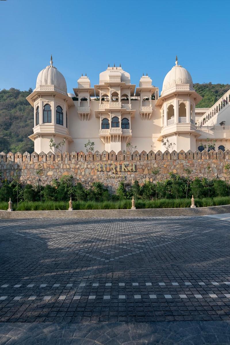 a building with two domes on top of it at Aurika, Udaipur - Luxury by Lemon Tree Hotels in Udaipur