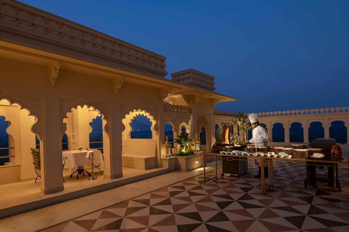 a chef standing in the middle of a large building at Aurika, Udaipur - Luxury by Lemon Tree Hotels in Udaipur