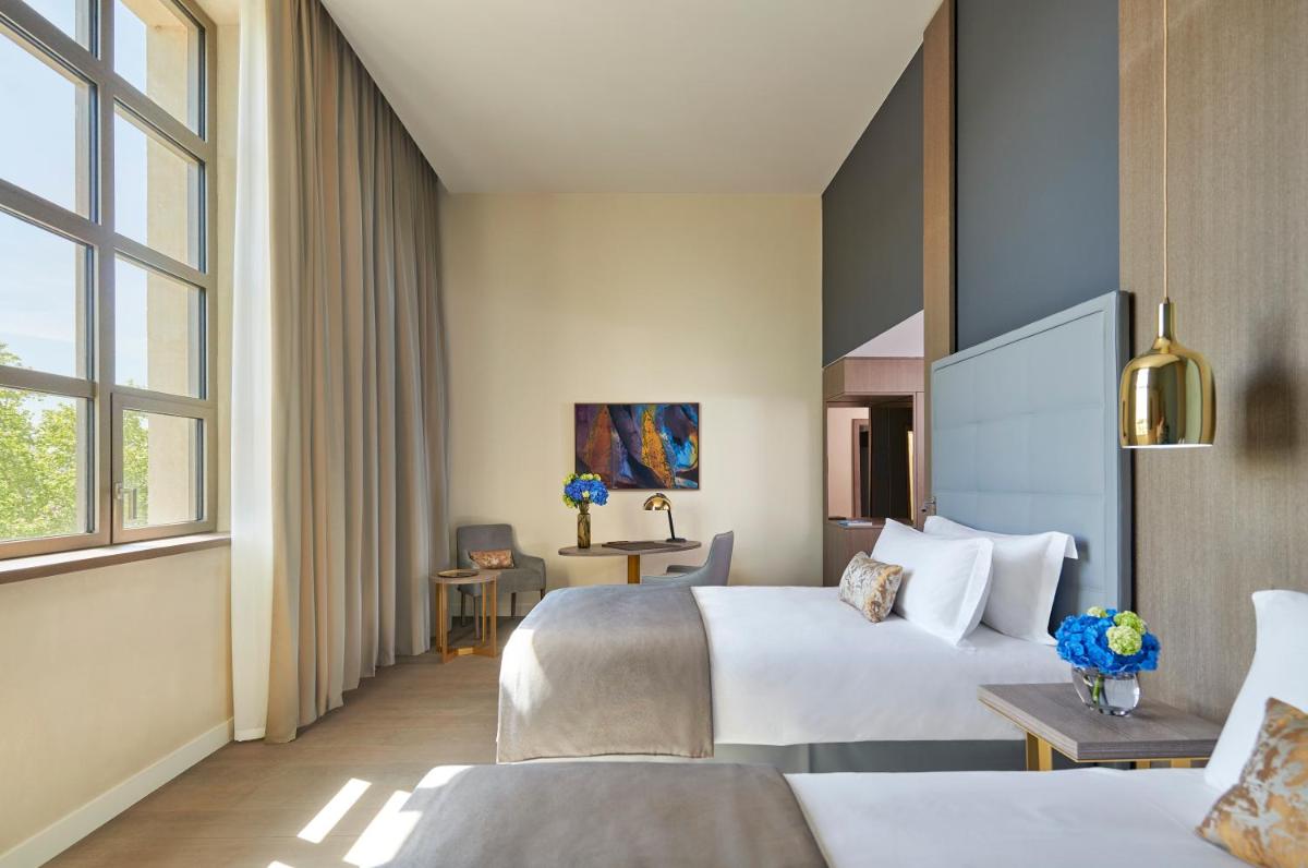 Un ou plusieurs lits dans un hébergement de l'établissement InterContinental Lyon - Hotel Dieu by IHG