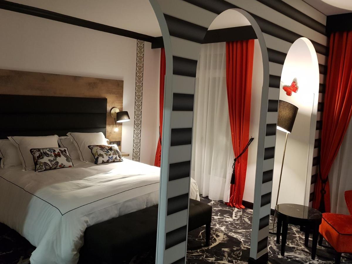 Un ou plusieurs lits dans un hébergement de l'établissement Hôtel du Barry Resort & Spa
