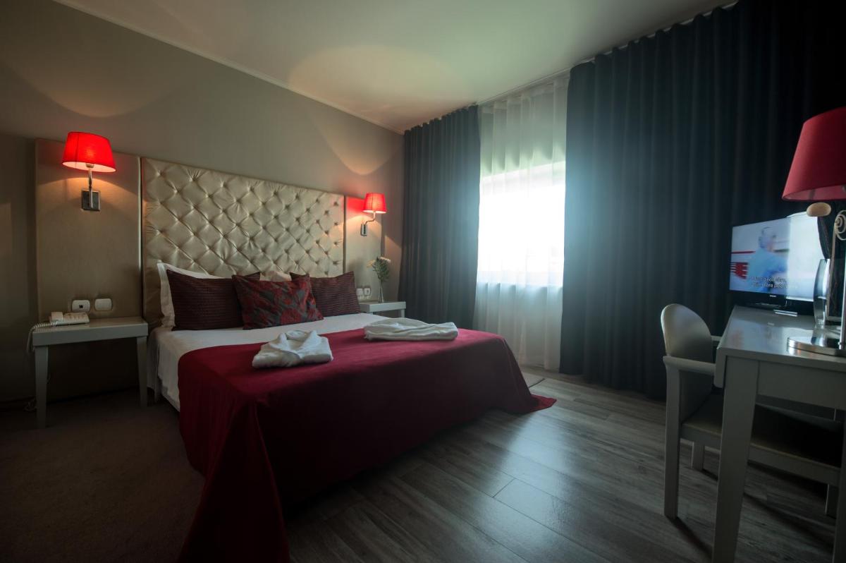 Uma cama ou camas num quarto em Hotel de Ilhavo Plaza & Spa