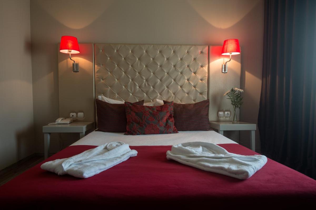 Uma cama ou camas num quarto em Hotel de Ilhavo Plaza & Spa