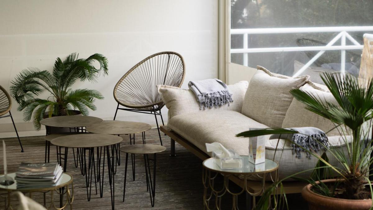 Coin salon dans l'établissement Le Diana Hôtel & Spa