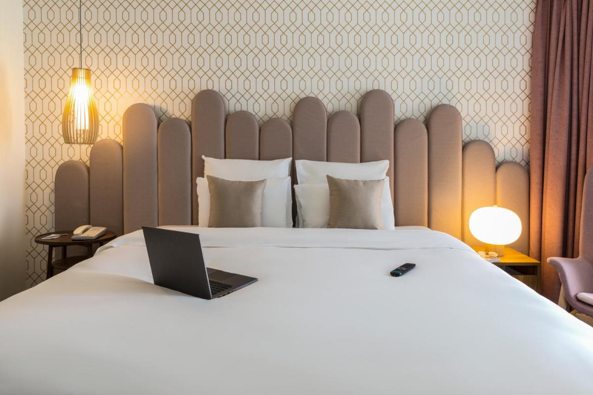 Un ou plusieurs lits dans un hébergement de l'établissement Mercure Aix-les-Bains Domaine de Marlioz Hôtel & Spa