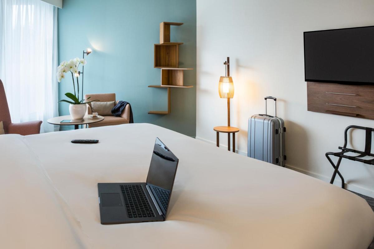 Télévision ou salle de divertissement dans l'établissement Mercure Aix-les-Bains Domaine de Marlioz Hôtel & Spa