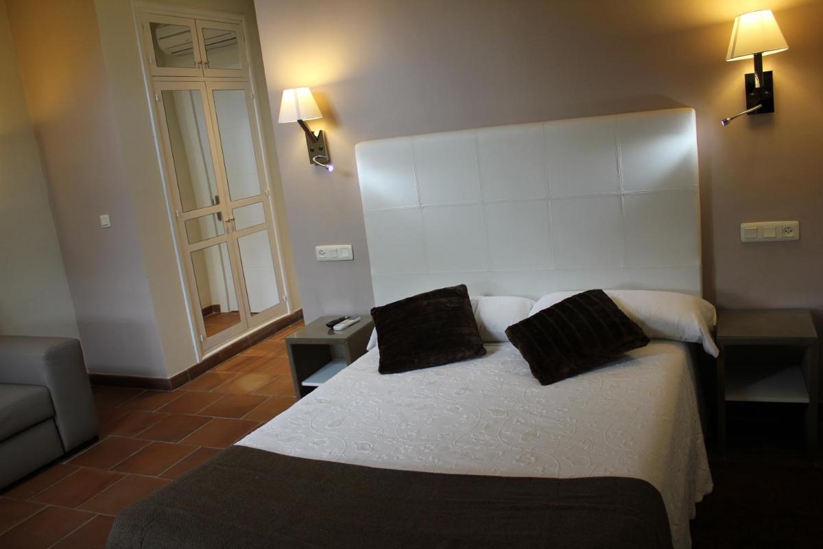 Cama o camas de una habitación en Hotel Leonor de Aquitania
