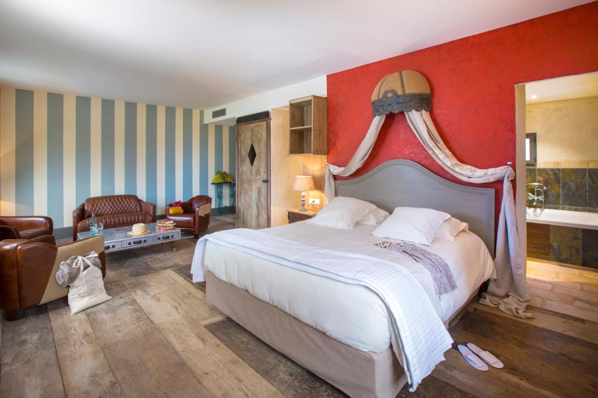 Un ou plusieurs lits dans un hébergement de l'établissement Hôtel-Spa Le Saint Cirq