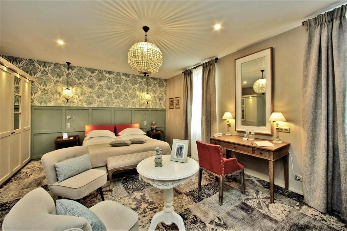 Coin salon dans l'établissement Les Glycines - Hôtel & Spa - Teritoria
