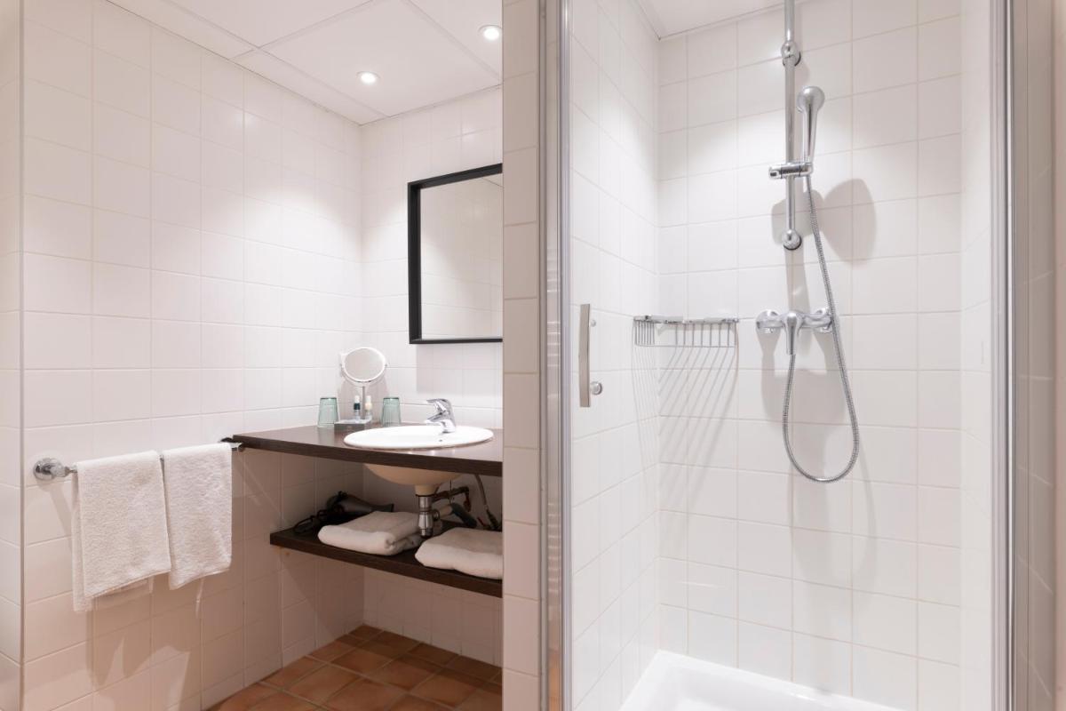 Salle de bains dans l'établissement La Résidence du Bailli
