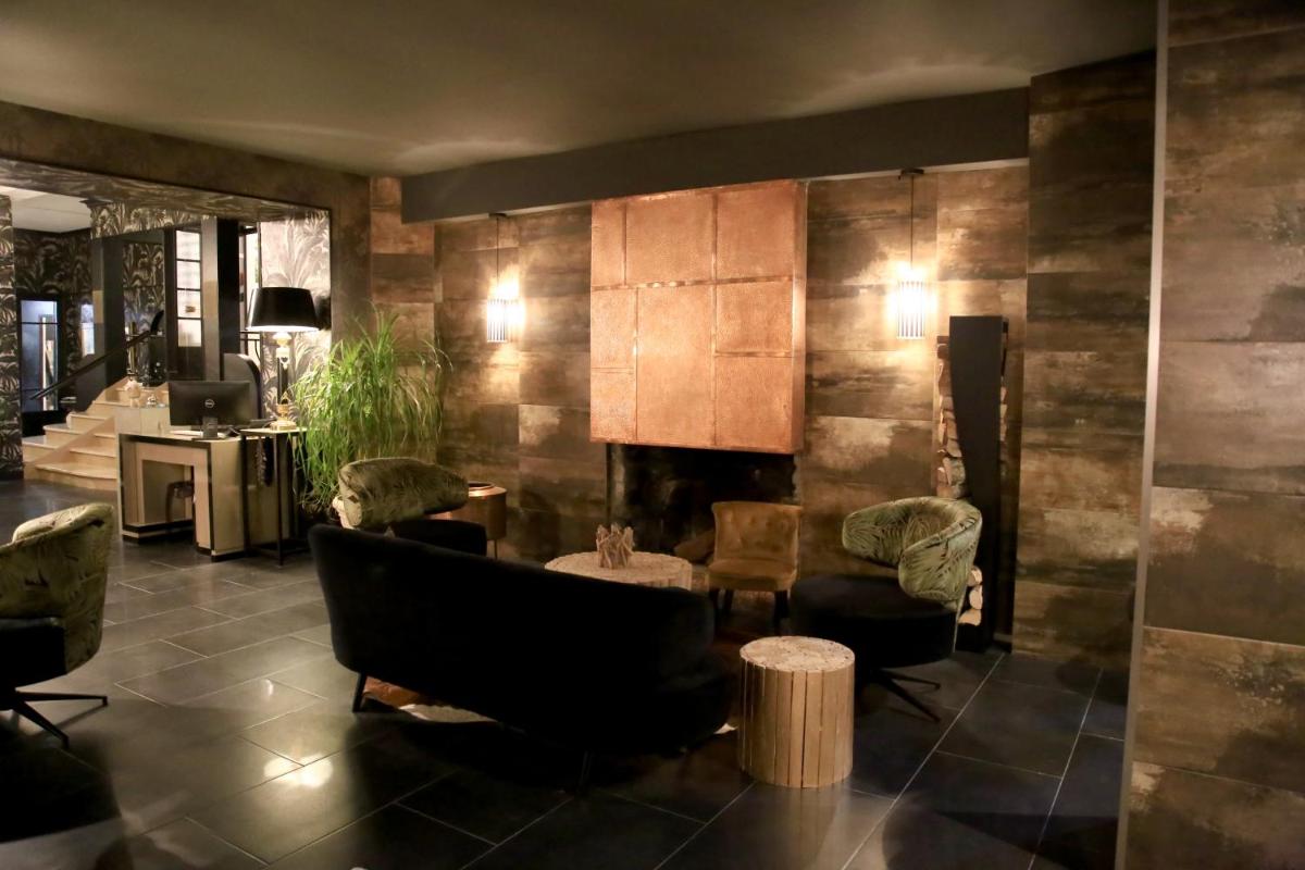 Coin salon dans l'établissement Hôtel du Barry Resort & Spa