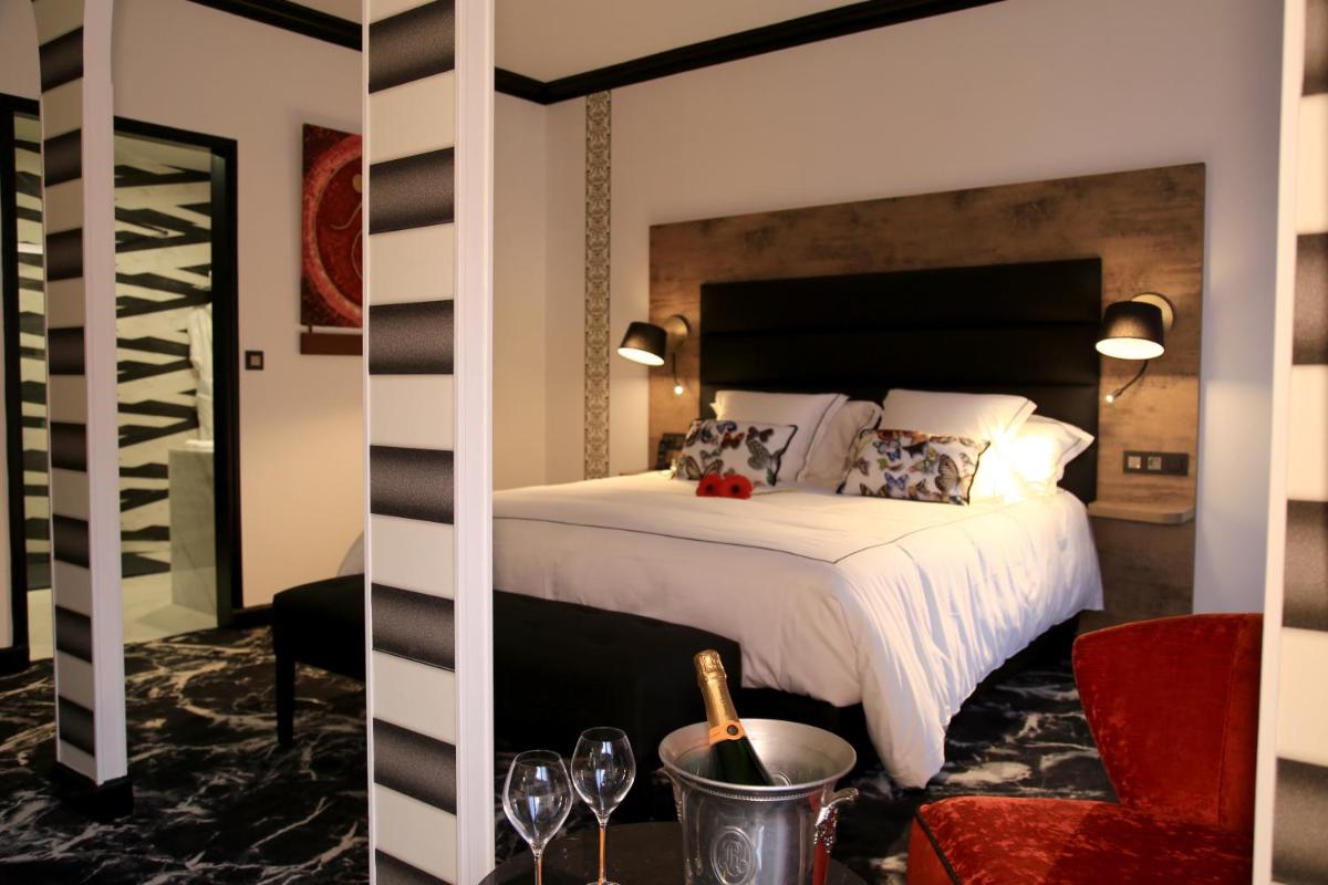 Un ou plusieurs lits dans un hébergement de l'établissement Hôtel du Barry Resort & Spa