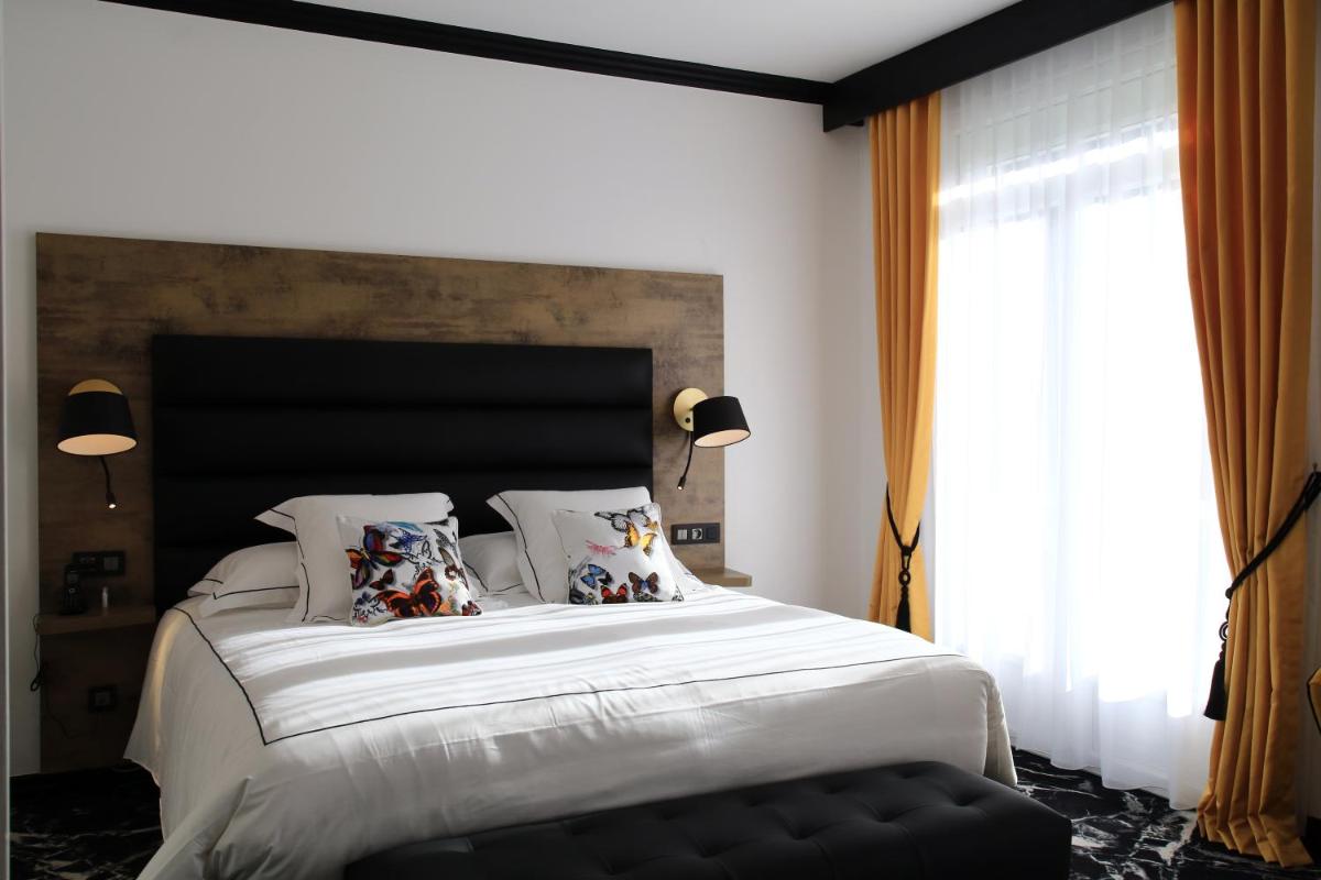 Un ou plusieurs lits dans un hébergement de l'établissement Hôtel du Barry Resort & Spa