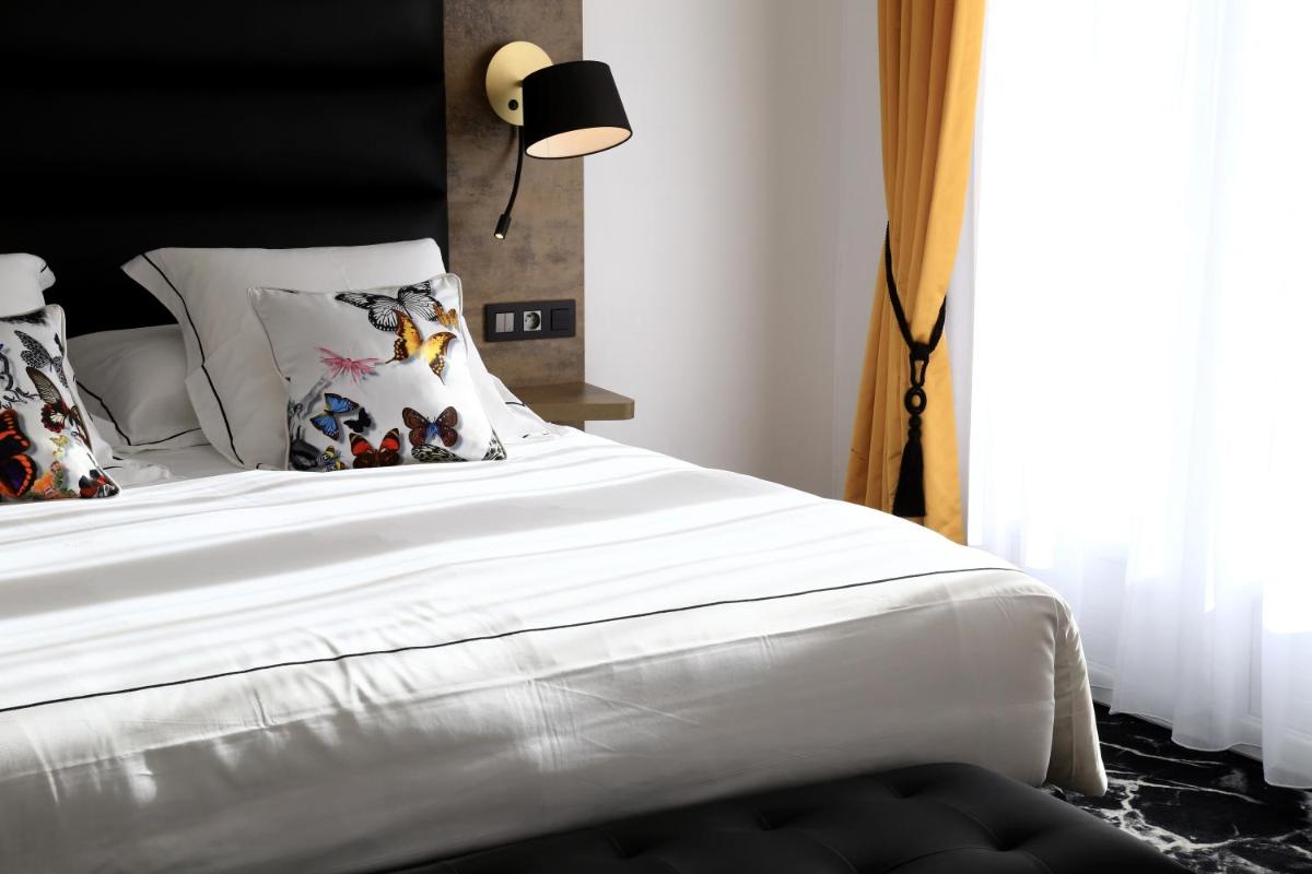 Un ou plusieurs lits dans un hébergement de l'établissement Hôtel du Barry Resort & Spa