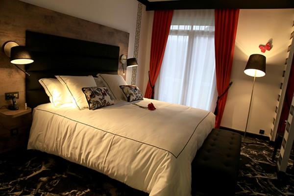 Un ou plusieurs lits dans un hébergement de l'établissement Hôtel du Barry Resort & Spa