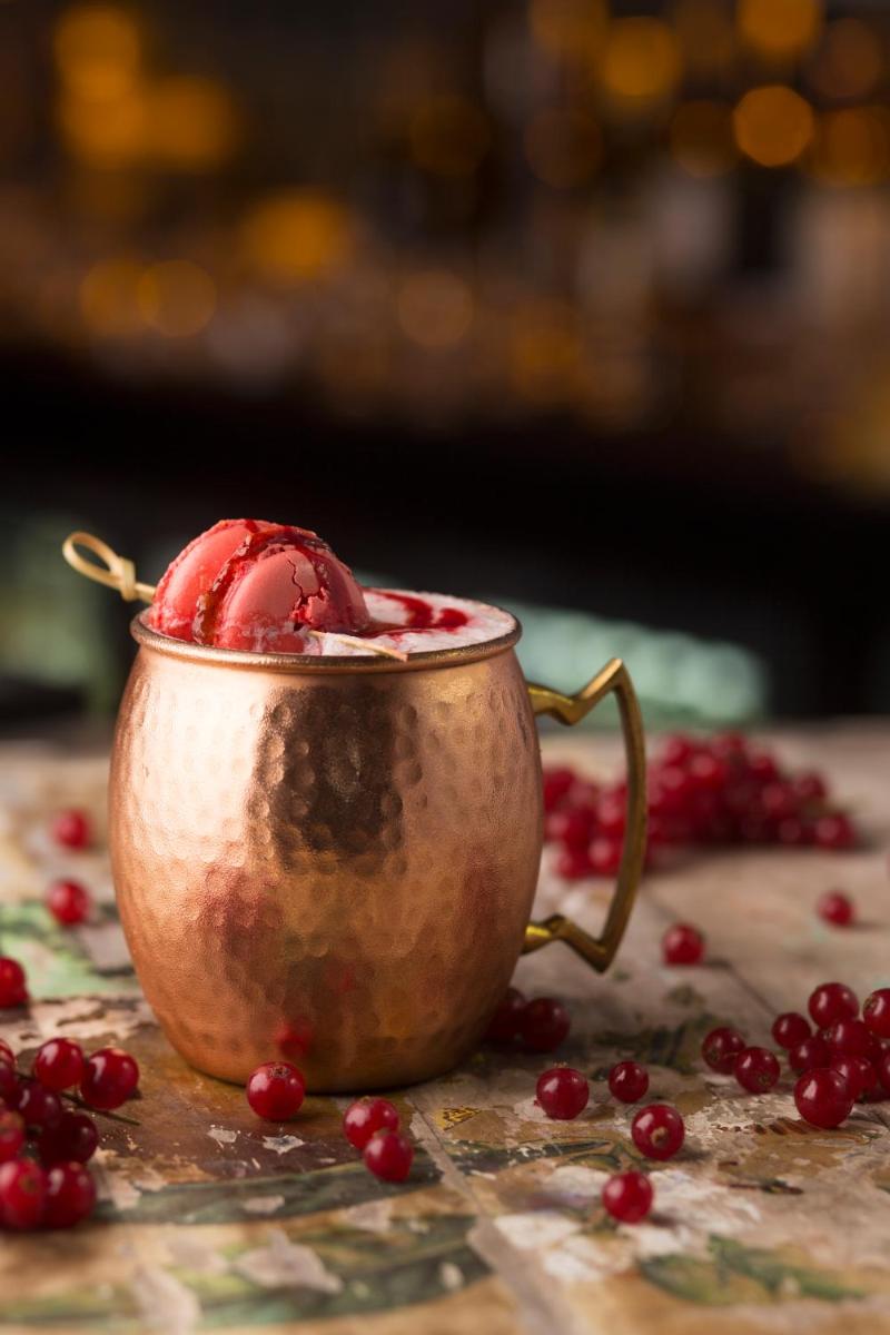 a gold cup with a red drink in it at Taj Palace, New Delhi in New Delhi a gold cup with a red drink in it at Taj Palace, New Delhi in New Delhi