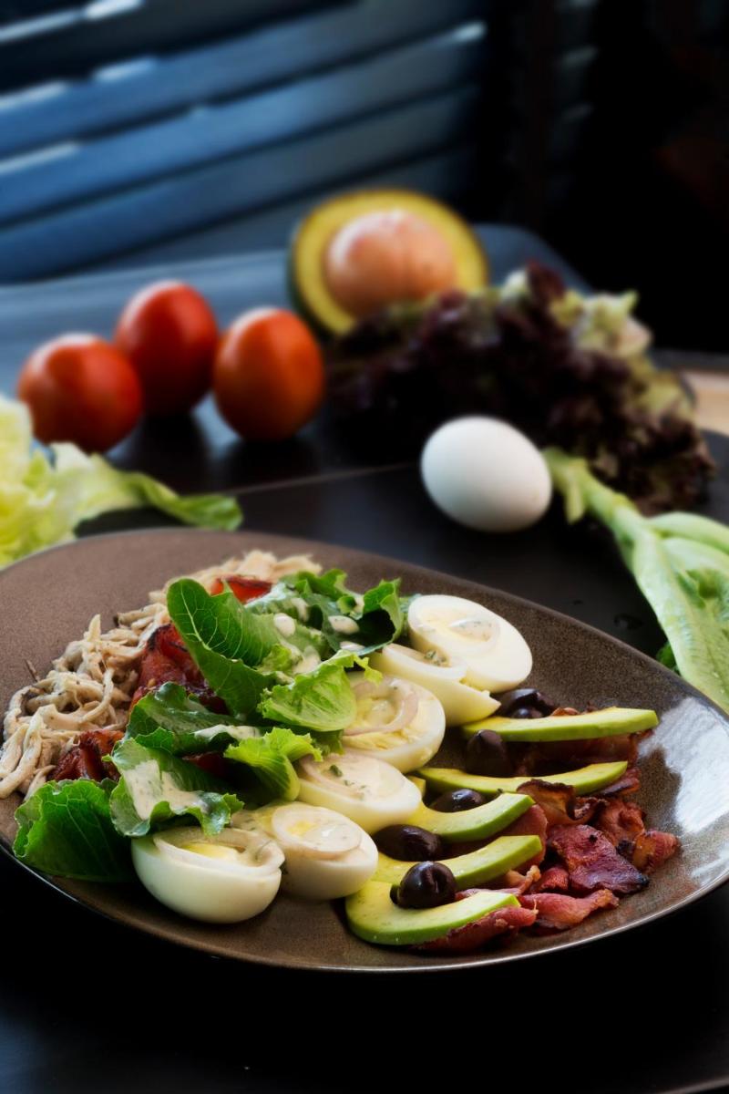 a plate of food with eggs and vegetables on a table at Taj Palace, New Delhi in New Delhi a plate of food with eggs and vegetables on a table at Taj Palace, New Delhi in New Delhi