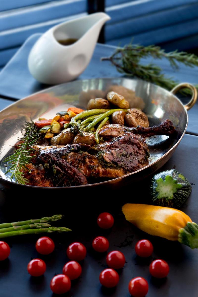 a plate of meat and vegetables on a table at Taj Palace, New Delhi in New Delhi a plate of meat and vegetables on a table at Taj Palace, New Delhi in New Delhi