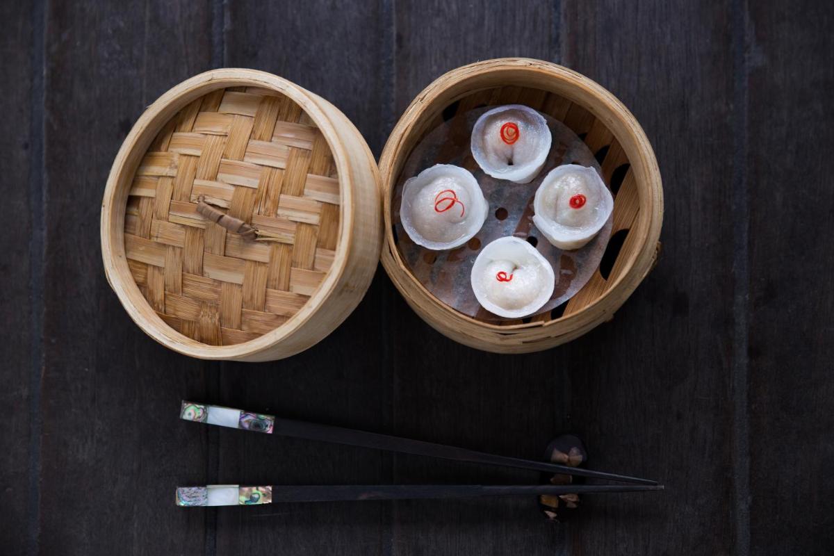 two baskets with sushi and chopsticks on a table at Taj Palace, New Delhi in New Delhi two baskets with sushi and chopsticks on a table at Taj Palace, New Delhi in New Delhi