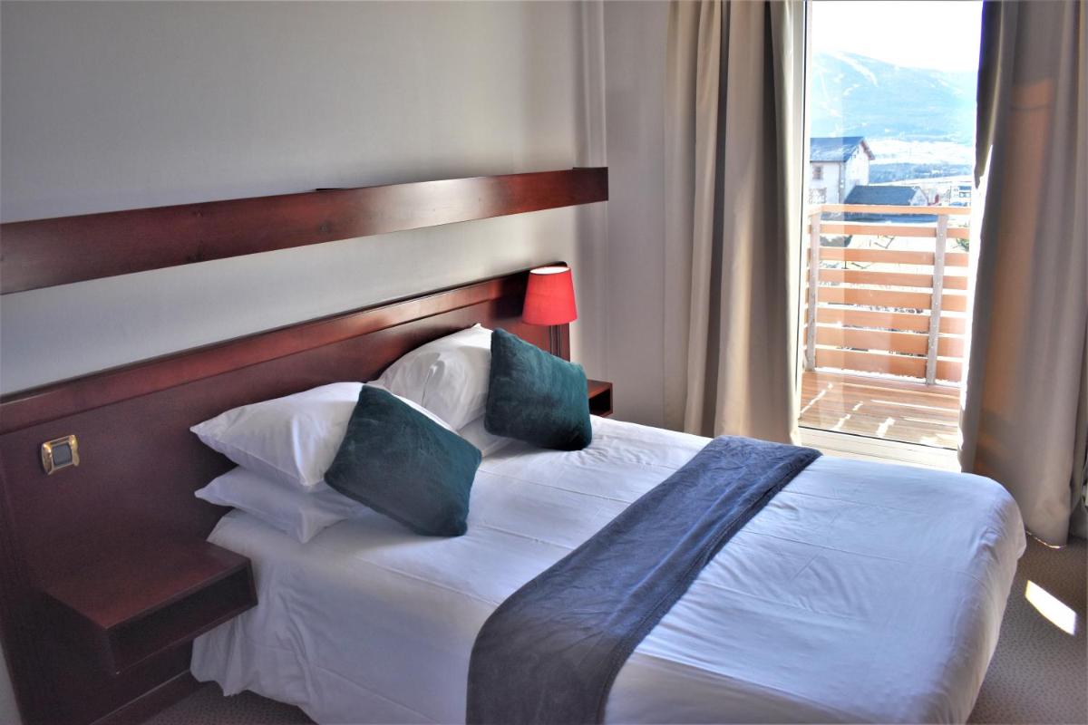 Un ou plusieurs lits dans un hébergement de l'établissement Hotel Corrieu