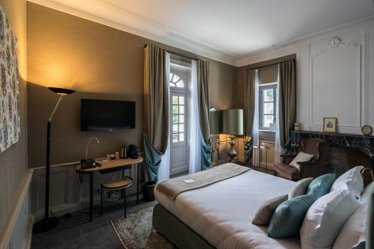 Un ou plusieurs lits dans un hébergement de l'établissement Le Général d'Elbée Hotel & Spa - Teritoria