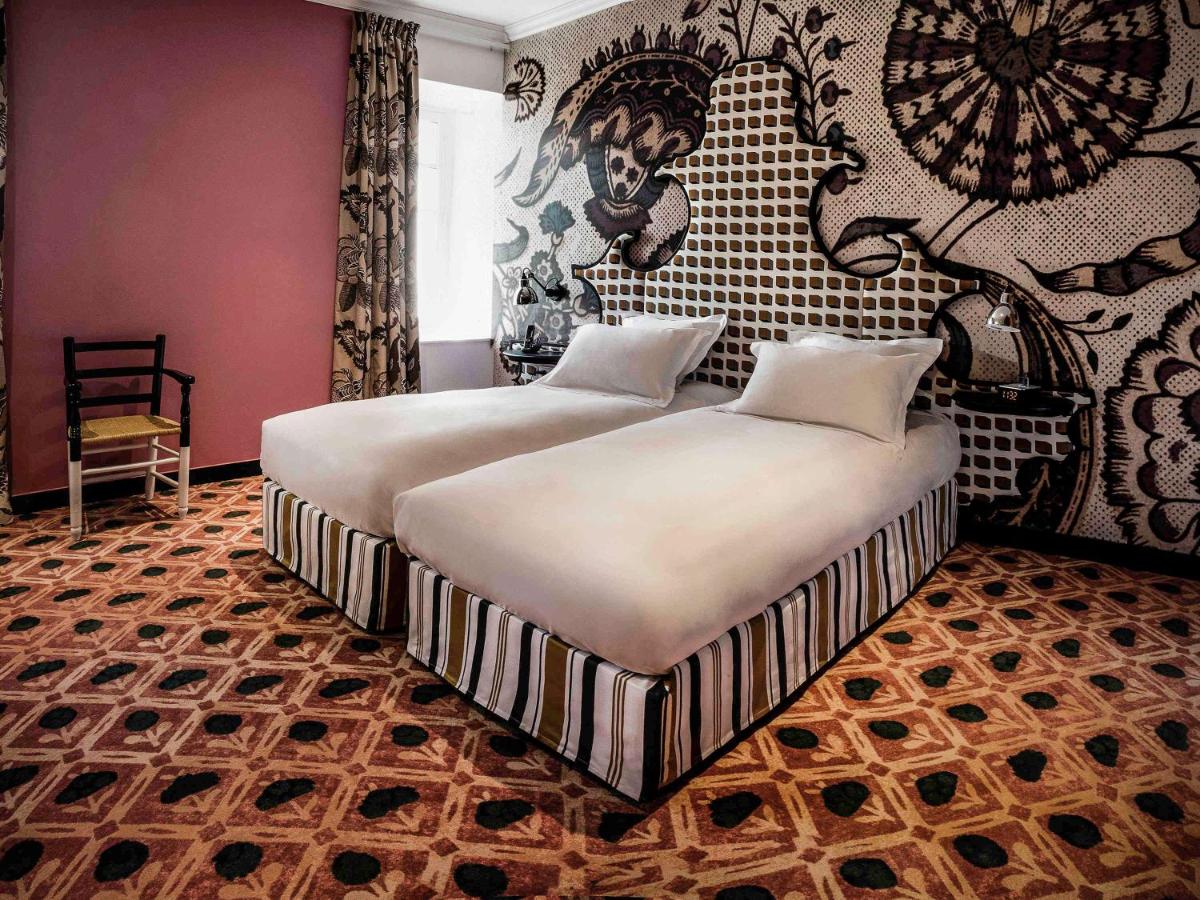Un ou plusieurs lits dans un hébergement de l'établissement Jules César Hotel & Spa Arles - MGallery Collection