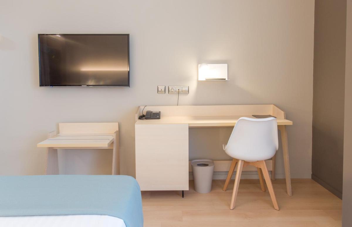 Una televisión o centro de entretenimiento en Hotel Olympia Valencia