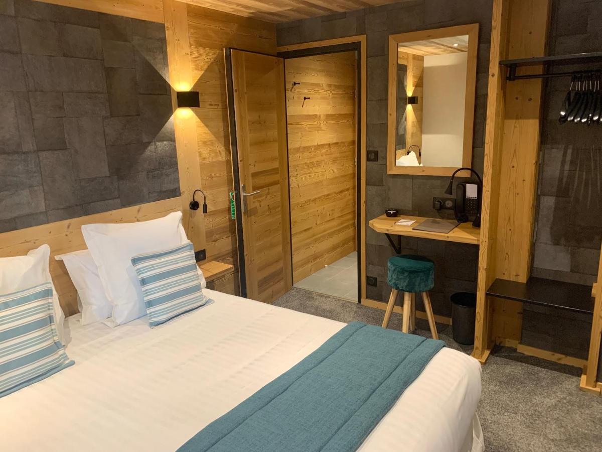 Un ou plusieurs lits dans un hébergement de l'établissement Hameau des Prodains - Hôtel