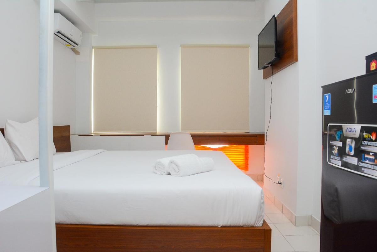Comfy Studio Room at Patraland Urbano Apartment By Travelio - Housity
