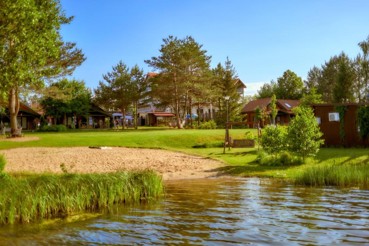 Domki Mazurskie w Ogrodach Złotej Łani Wiartel - Klimatyczne Apartamenty i Pokoje Widokowe - Housity