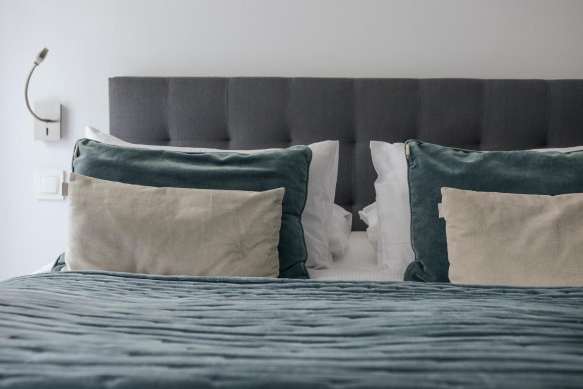 Un ou plusieurs lits dans un hébergement de l'établissement Petit Hôtel Confidentiel