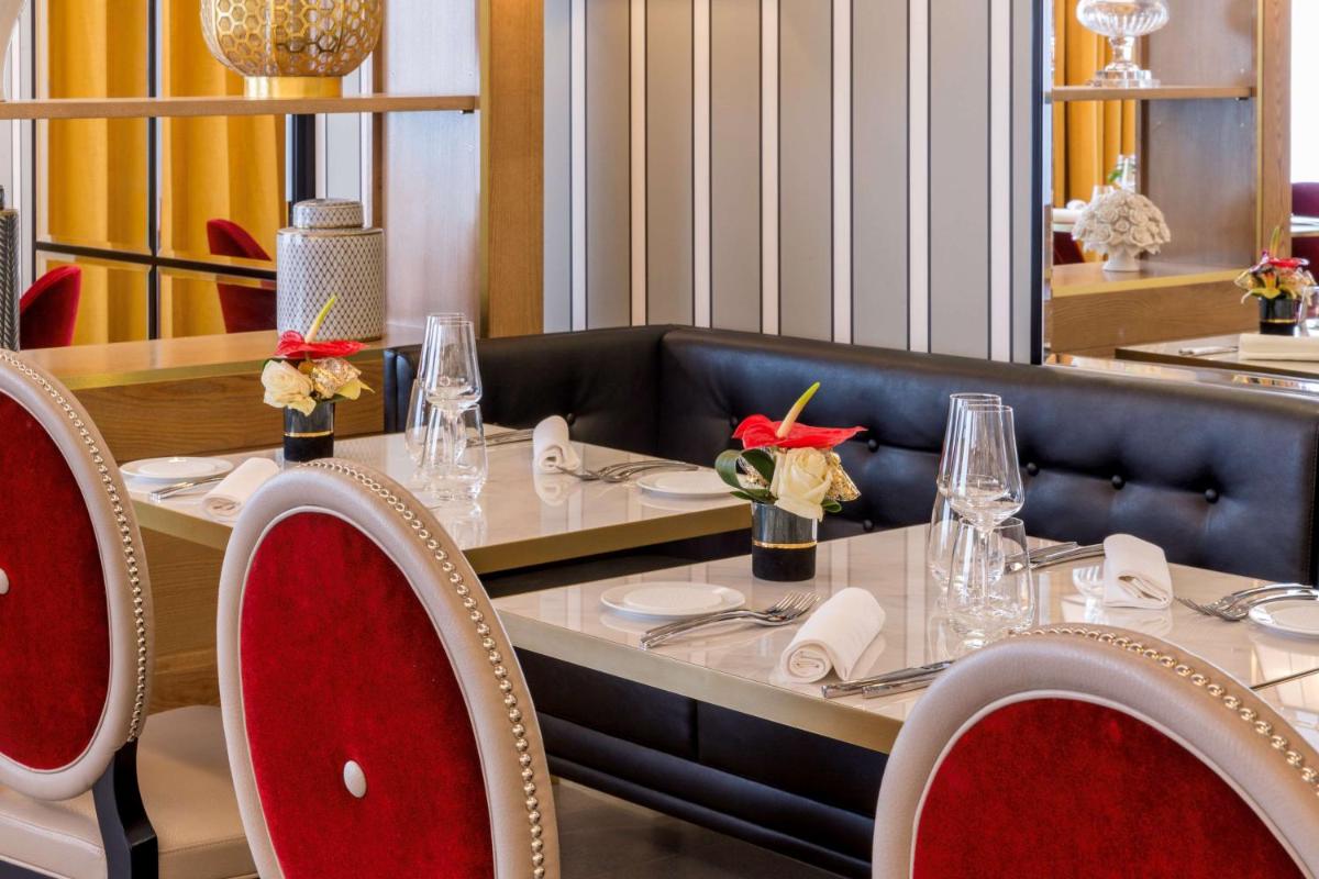 Coin salon dans l'établissement Hôtel & Spa Les Sept Fontaines Best Western Premier