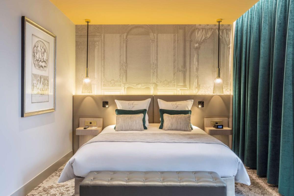 Un ou plusieurs lits dans un hébergement de l'établissement Hôtel & Spa Les Sept Fontaines Best Western Premier