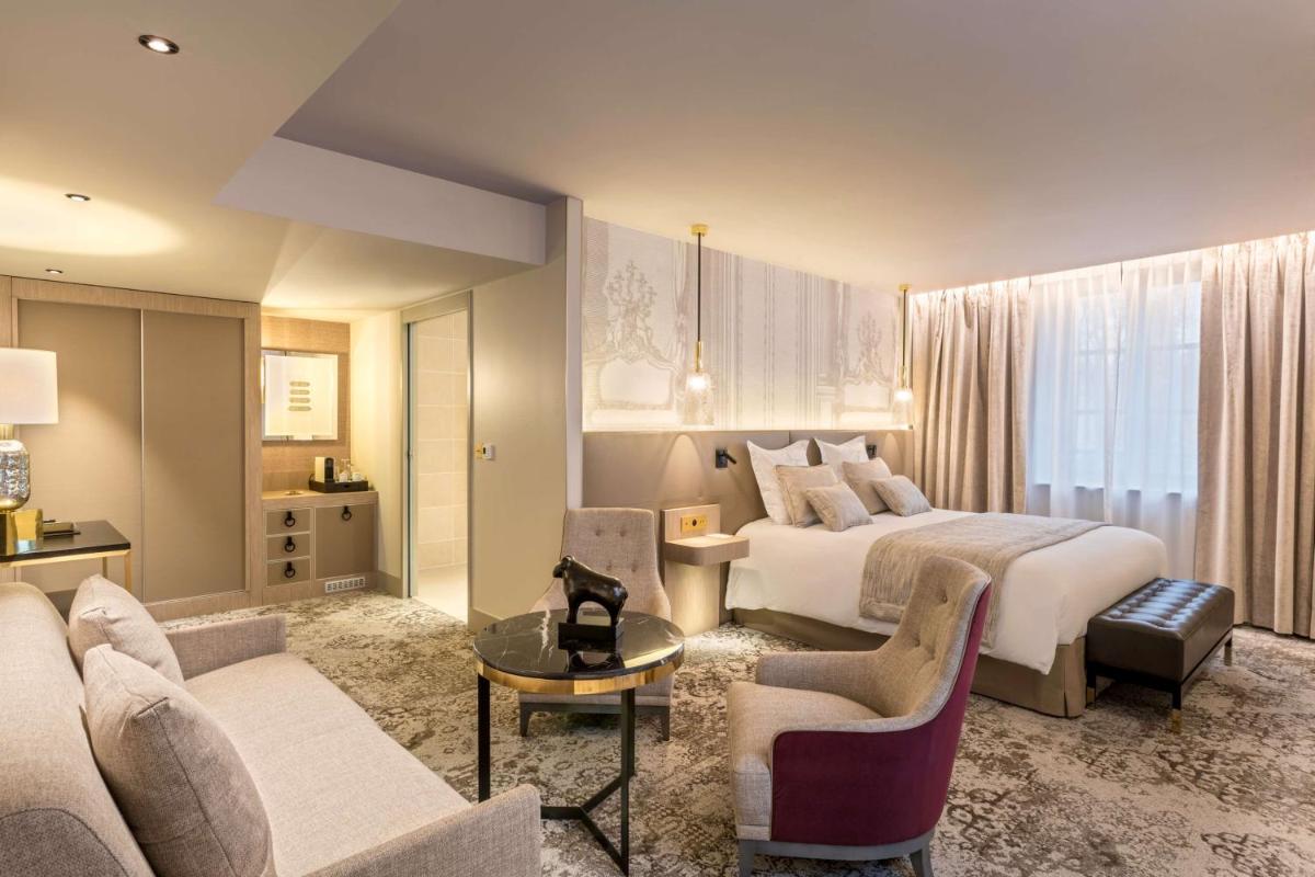 Un ou plusieurs lits dans un hébergement de l'établissement Hôtel & Spa Les Sept Fontaines Best Western Premier