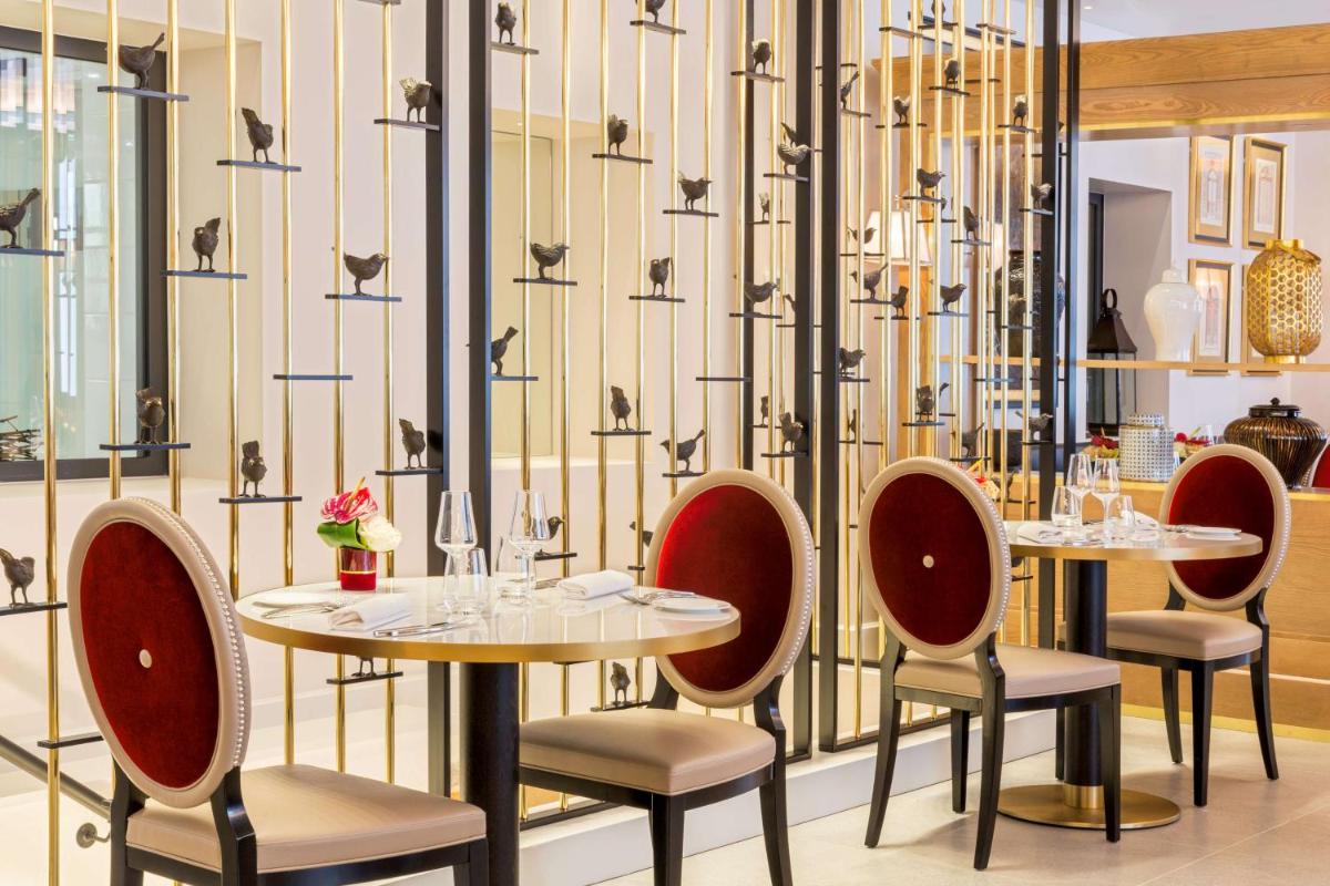 Coin salon dans l'établissement Hôtel & Spa Les Sept Fontaines Best Western Premier