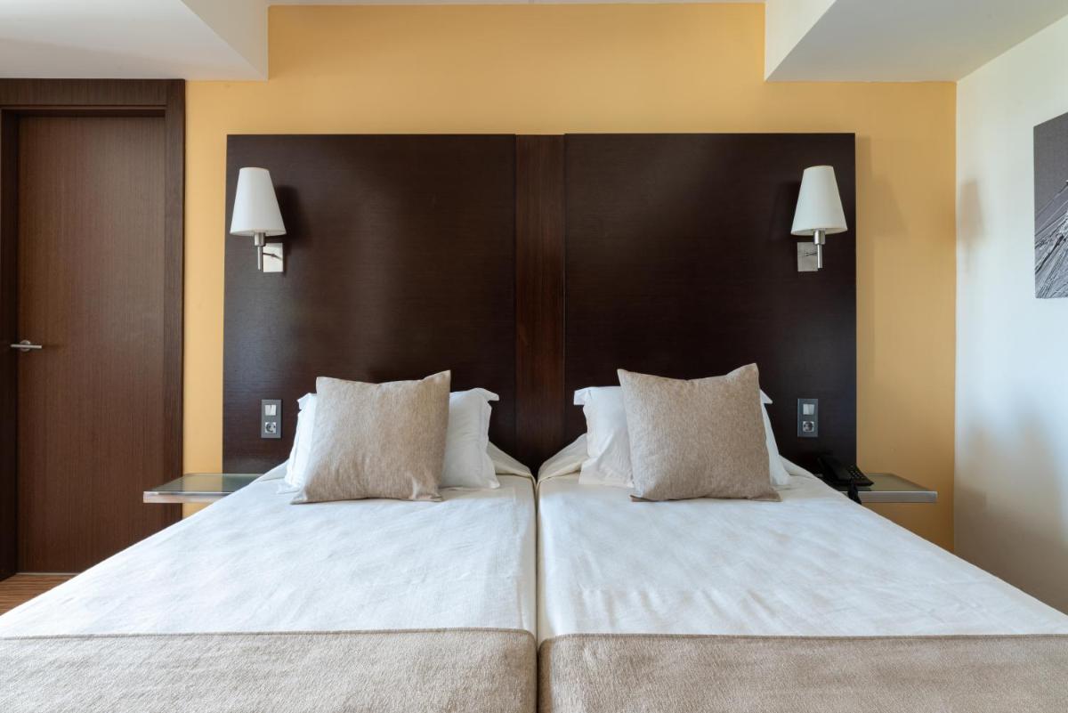 Cama o camas de una habitación en Nautic Hotel & Spa