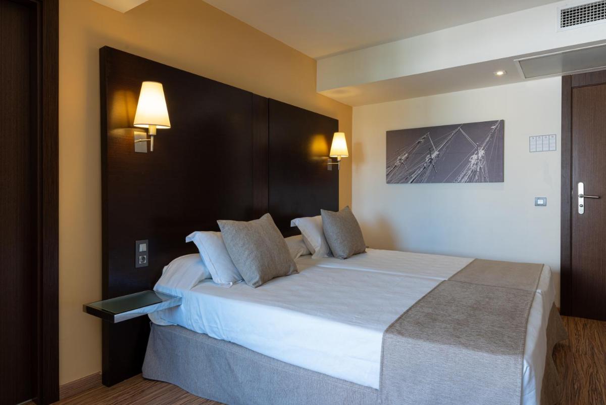 Cama o camas de una habitación en Nautic Hotel & Spa