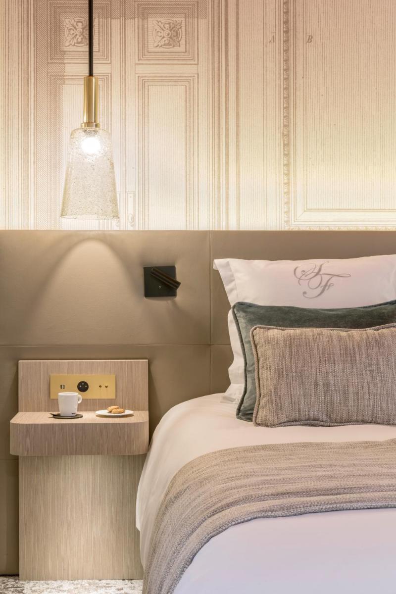 Un ou plusieurs lits dans un hébergement de l'établissement Hôtel & Spa Les Sept Fontaines Best Western Premier