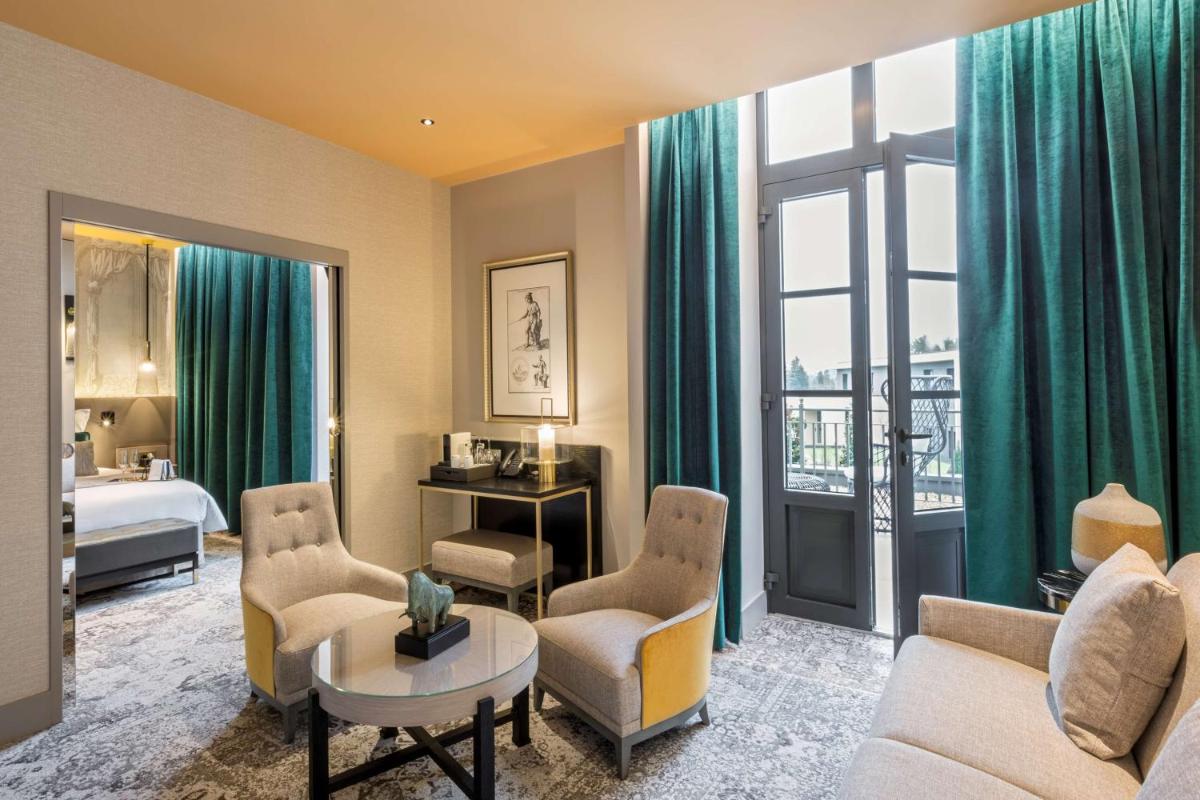 Un ou plusieurs lits dans un hébergement de l'établissement Hôtel & Spa Les Sept Fontaines Best Western Premier