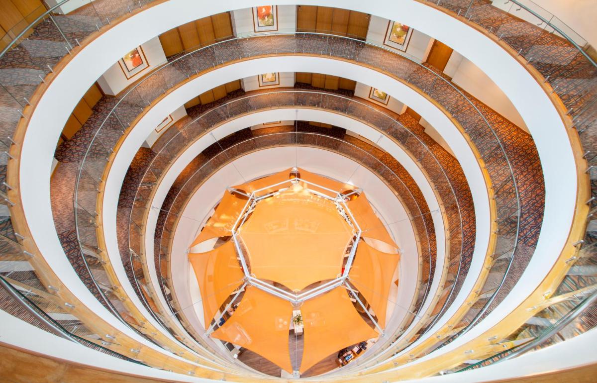 an overhead view of a spiral staircase in a building at Hyatt Place Hyderabad Banjara Hills in Hyderabad