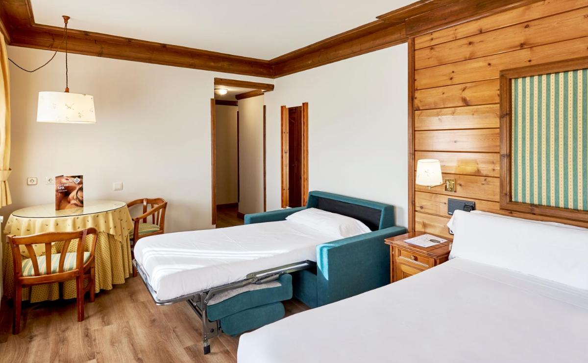 Cama o camas de una habitación en Hotel Grèvol Spa