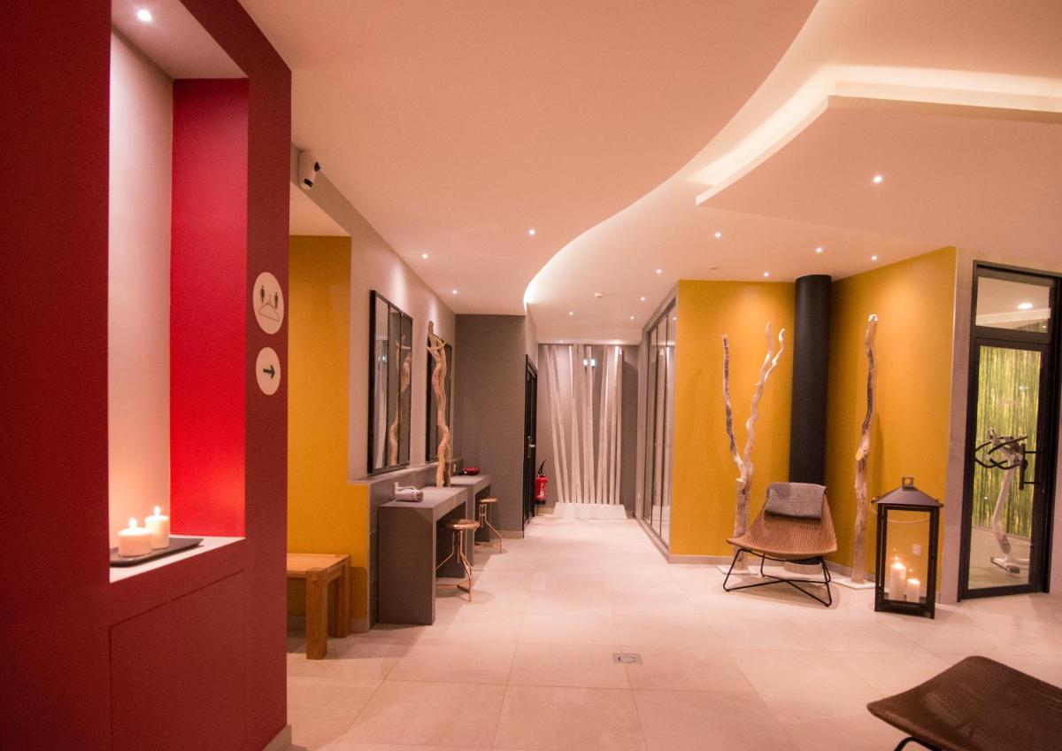 Coin salon dans l'établissement Au Soleil, Hôtel Restaurant & Spa