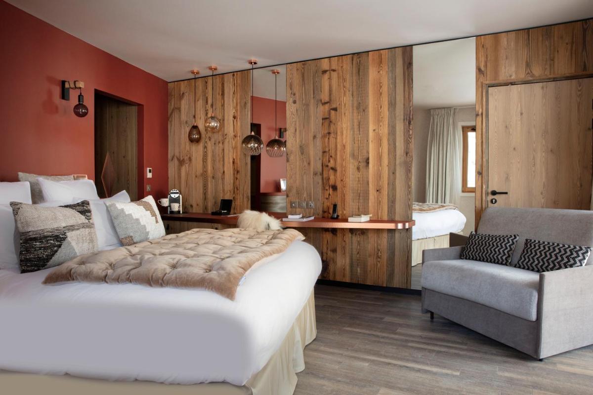Un ou plusieurs lits dans un hébergement de l'établissement Grandes Rousses Hotel & Spa